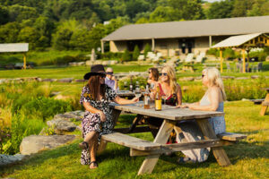 Friends enjoy an outdoor tasting at Banner Elk Winery
