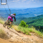 A biker makes her way down the trail at Beech Mtn Bike Park near Banner Elk NC