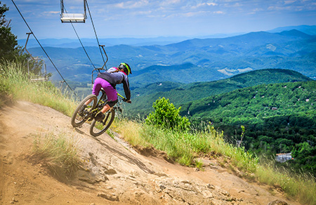 A biker makes her way down the trail at Beech Mtn Bike Park near Banner Elk NC