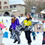 Snowboarders and skiers enjoy Beech Mountain Resort in North Carolina