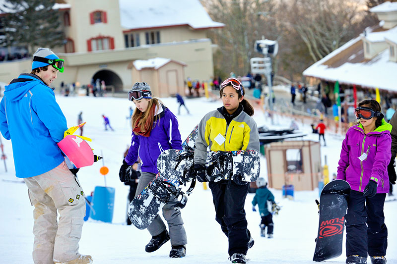 Snowboarders and skiers enjoy Beech Mountain Resort in North Carolina
