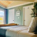 Main bedroom features natural light and mountain views