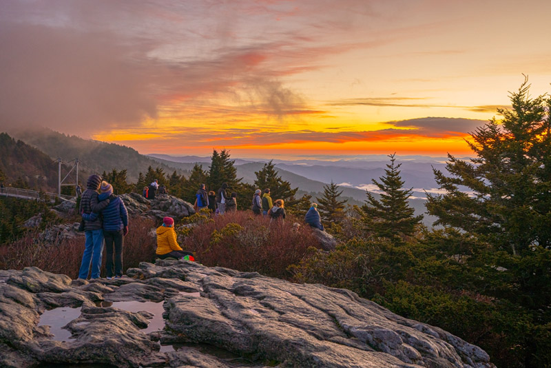 Event-Grandfather-Mtn-New-Years-sunrise-swinging-bridge The sun rises over Grandfather Mountain at the New Year's Day sunrise celebration