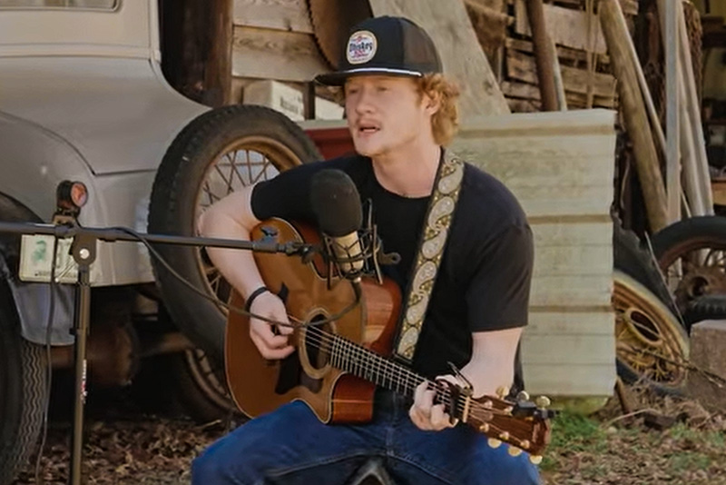 Kyle Horton plays guitar and sings in a YouTube video