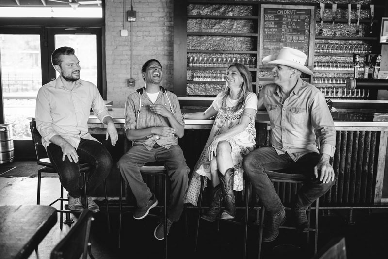 Members of My New Favorites Band share a bar-side laugh