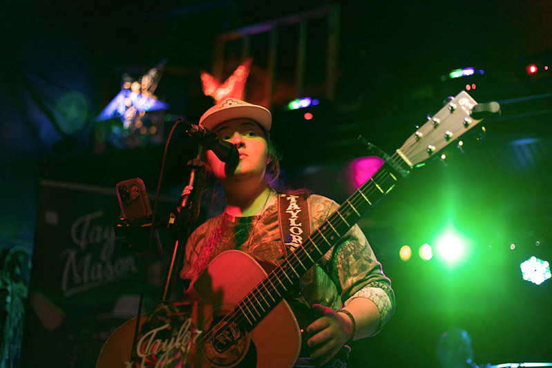 Musician Taylor Mason performs live on stage