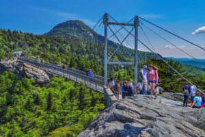People enjoying the Mile High Swinging Bridge at Grandfather Mountain in NC