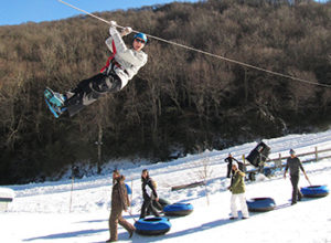 The top places for snow tubing in North Carolina are near Banner Elk, including Hawksnest, which offers tubing and ziplining