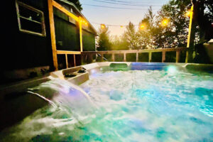 A large hot tub is a popular feature at the Laurel Cottage vacation rental