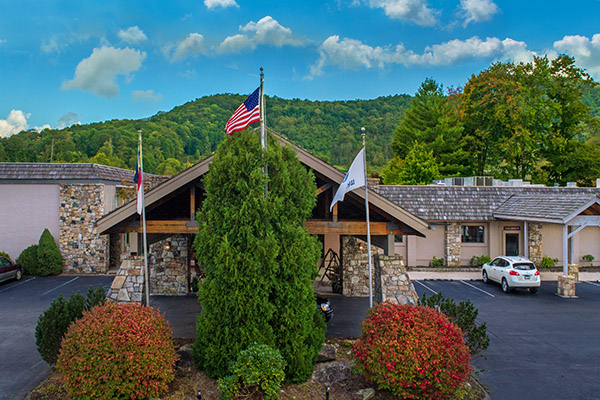 Exterior photo of Lodge at Banner Elk framed by mountains