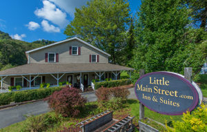 Little Main Street Inn & Suites under blue skies