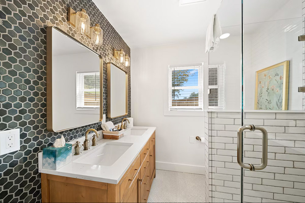 Luxurious bathroom at with white tiles at the Pink House vacation home in Banner Elk