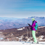 A skier takes in the view from the top of the slopes at Beech Mountain ski resort in North Carolina