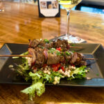 Tenderloin skewers over Israeli couscous