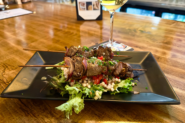 Tenderloin skewers over Israeli couscous