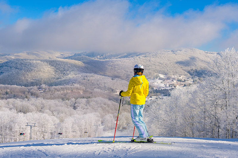 Blue sky skiing day in NC at Sugar Mtn Resort near Boone.