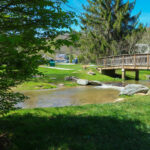 Bridge and small waterfall at Tate-Evans Park Banner Elk NC