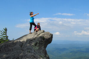 Mom and daughter enjoy the panoramic view from The Blowing Rock family attraction in NC mountains