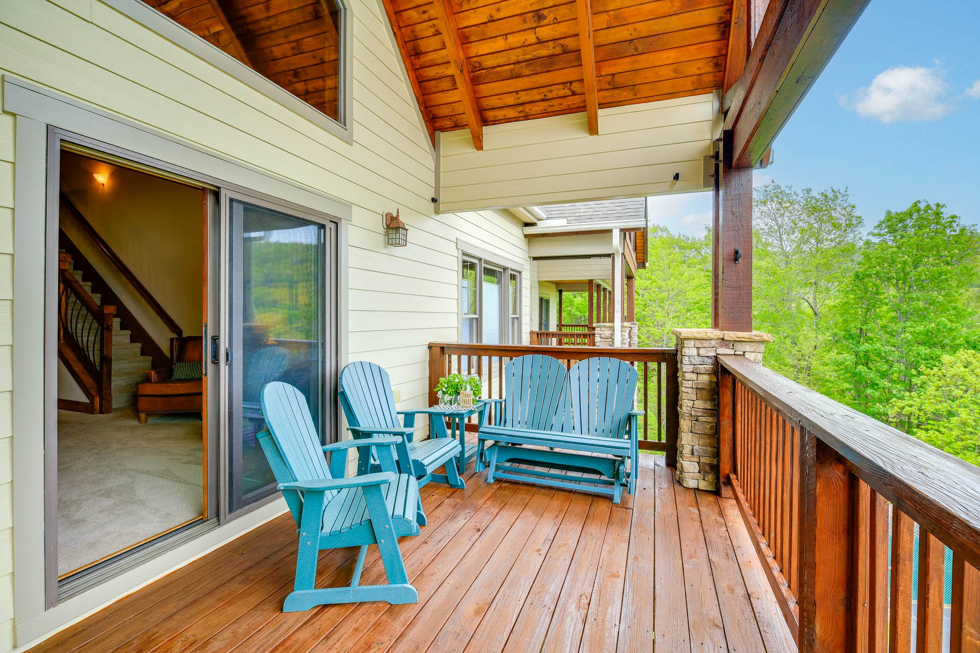 Adirondack chairs on the wooden porch with mountain views