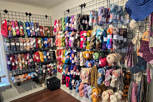 Robust selection of alpaca yarns adorn the racks at Apple Hill Outpost